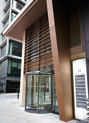 15 Fetter Lane, EC4A, London Brise Soleil, column and canopy in Chocolate PVD stainless steel V-Grooved and folded to appear as solid bronze.