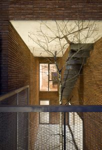 Family house and home office. An internal courtyard brings light to the heart of the house across all levels. Architecture and Interior design by Bach Arquitectes + Antonio Moll